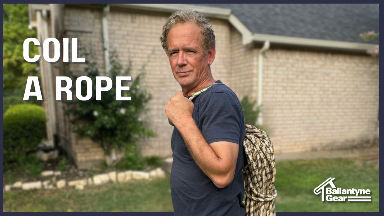 man holding rope coiled in front yard teaching safety