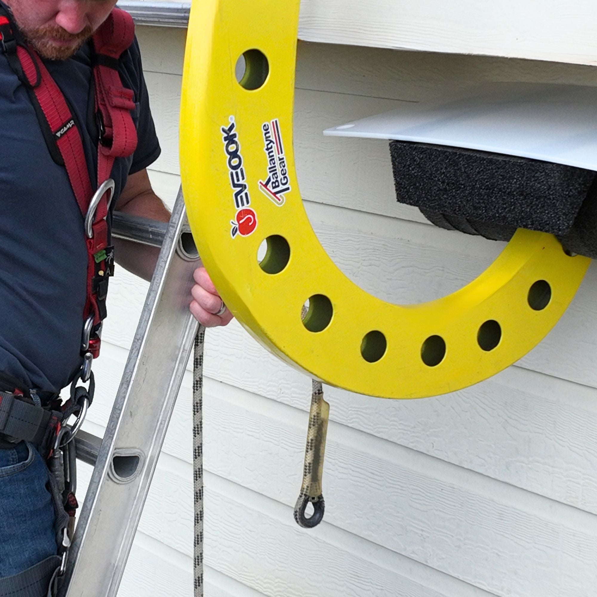 Installation of a SoffitGuard on the Eveook Fall Protection System designed to protect vulnerable aluminum and vinyl soffits on a roofing jobsite