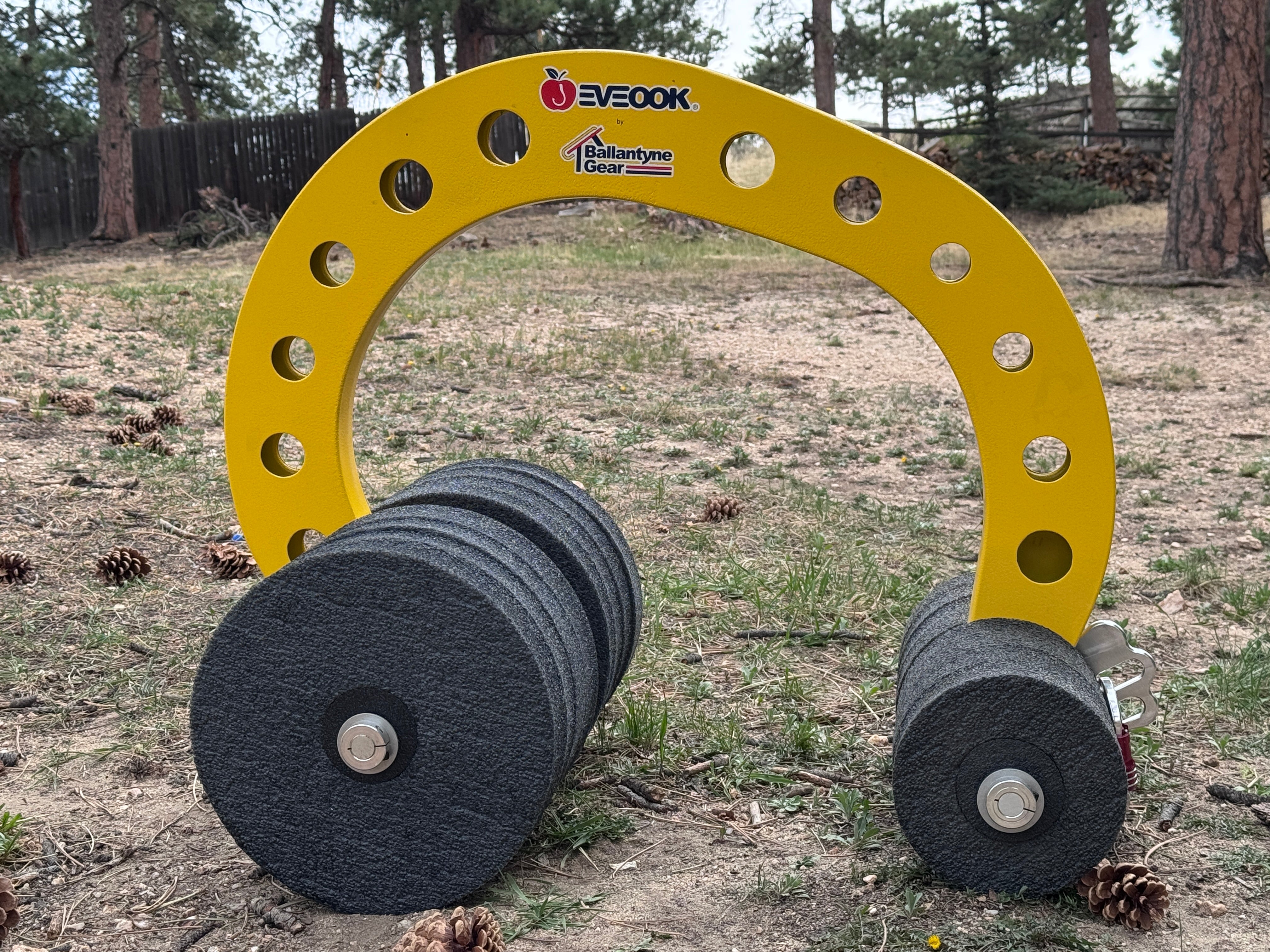 Eveook Fall Protection System roof anchor with both 7 inch and 12 inch wheels on a grassy outdoor area