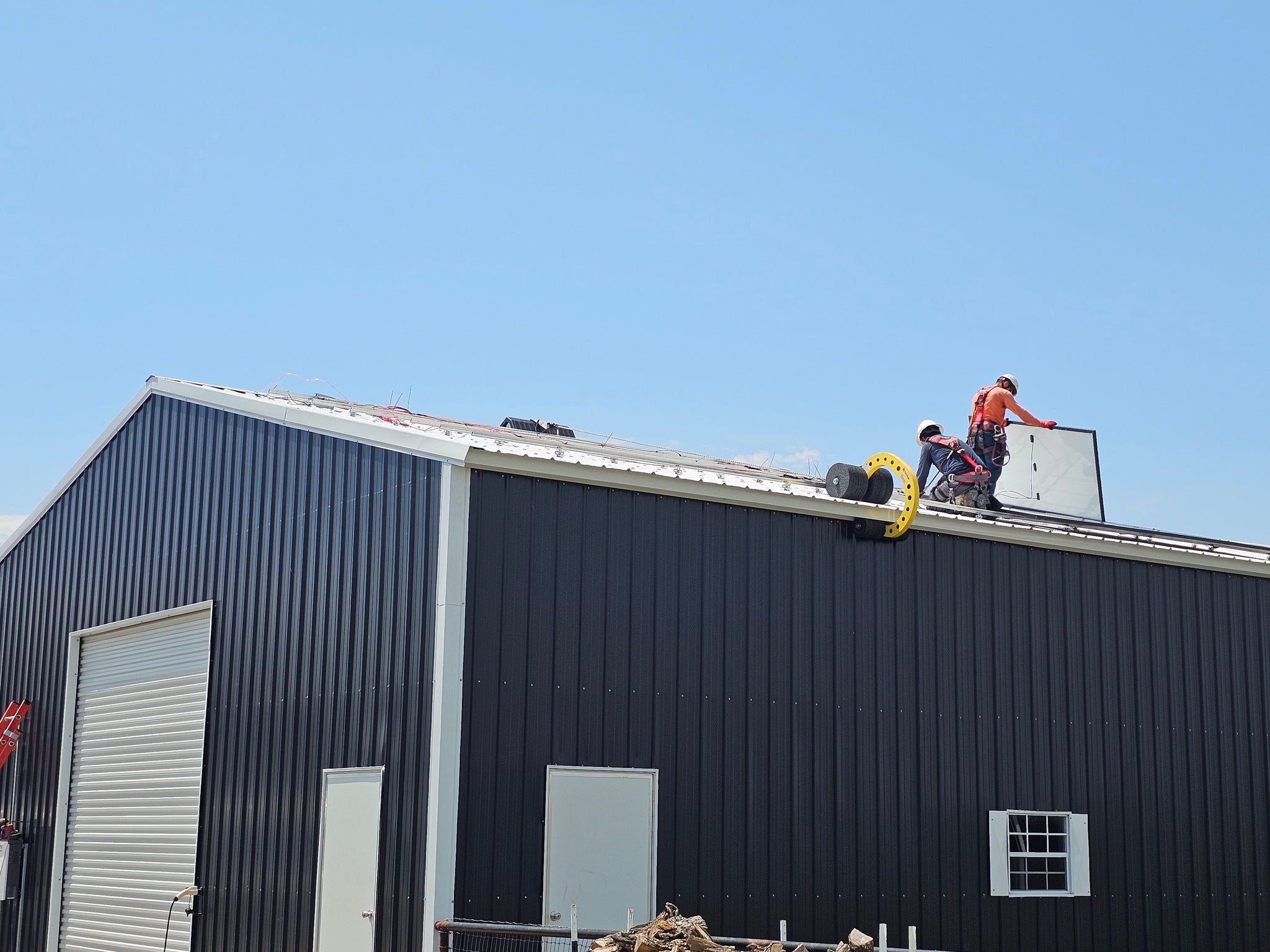 Solar panel roof work with 7 inch and 12 inch wheels on metal sloped roof
