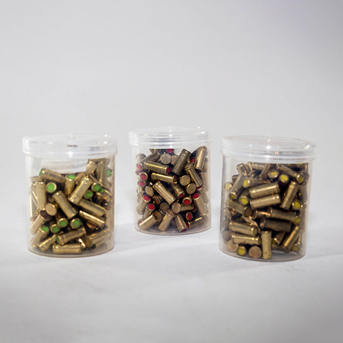 Three clear plastic containers filled with green and red colored .22 blank cartridges for line thrower for Eveook fall protection system