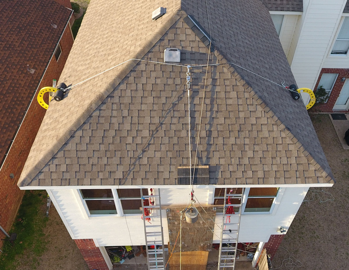 Testing rope with Eveook non-penetrating fall protection system for residential style sloped roofs.