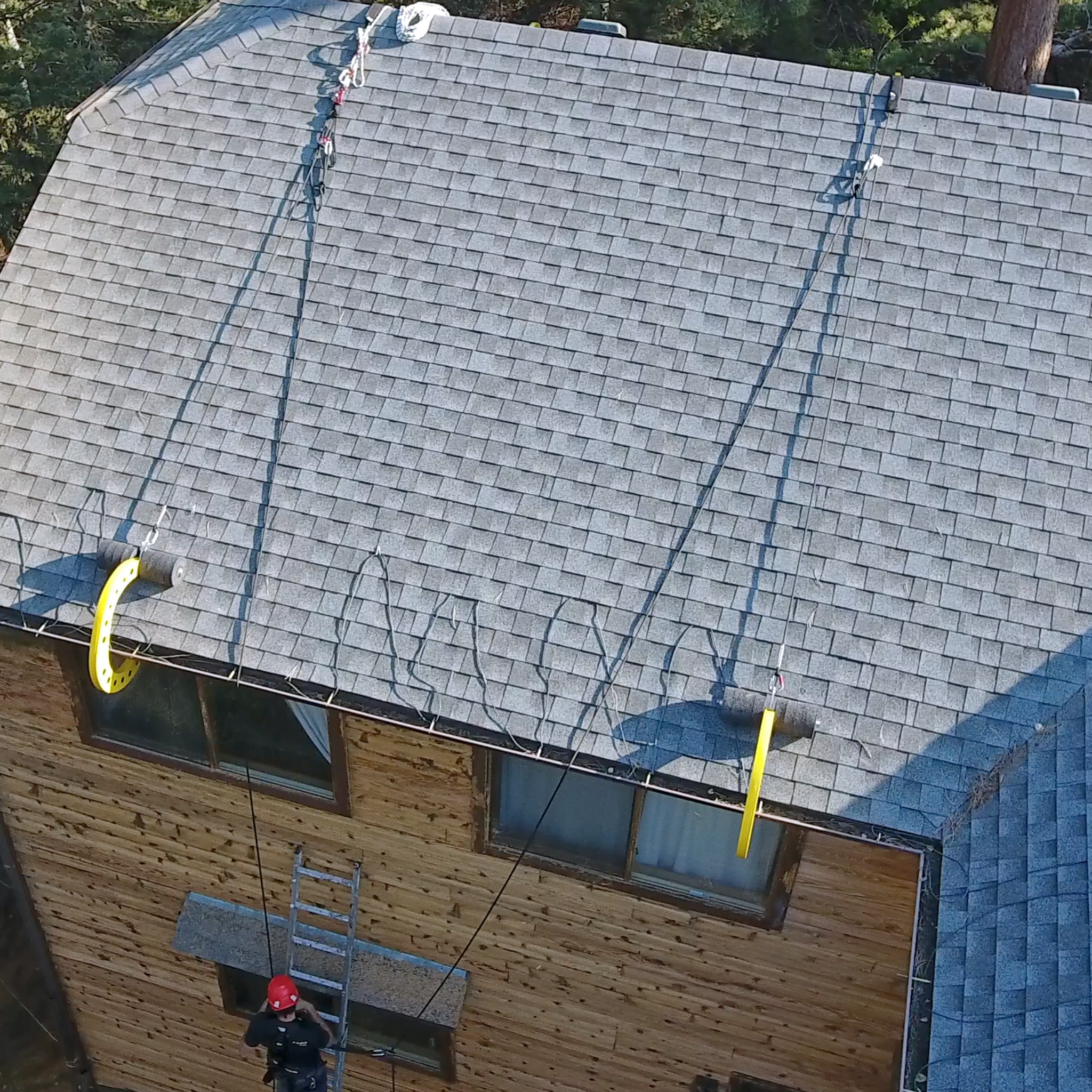 Eveook support systems for fall protection expanding protected work surface area on sloped roof