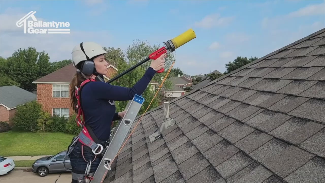 Video of woman on a ladder at roff edge launching line thrower over sloped roof
